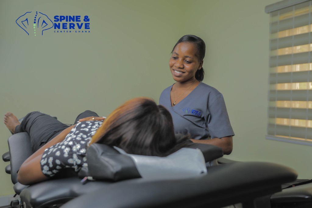 Clinician providing non surgical spinal care at Spine and Nerve Center Ghana